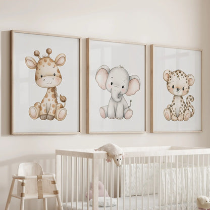 Baby safari animals appear in three oak-framed prints above a nursery crib.