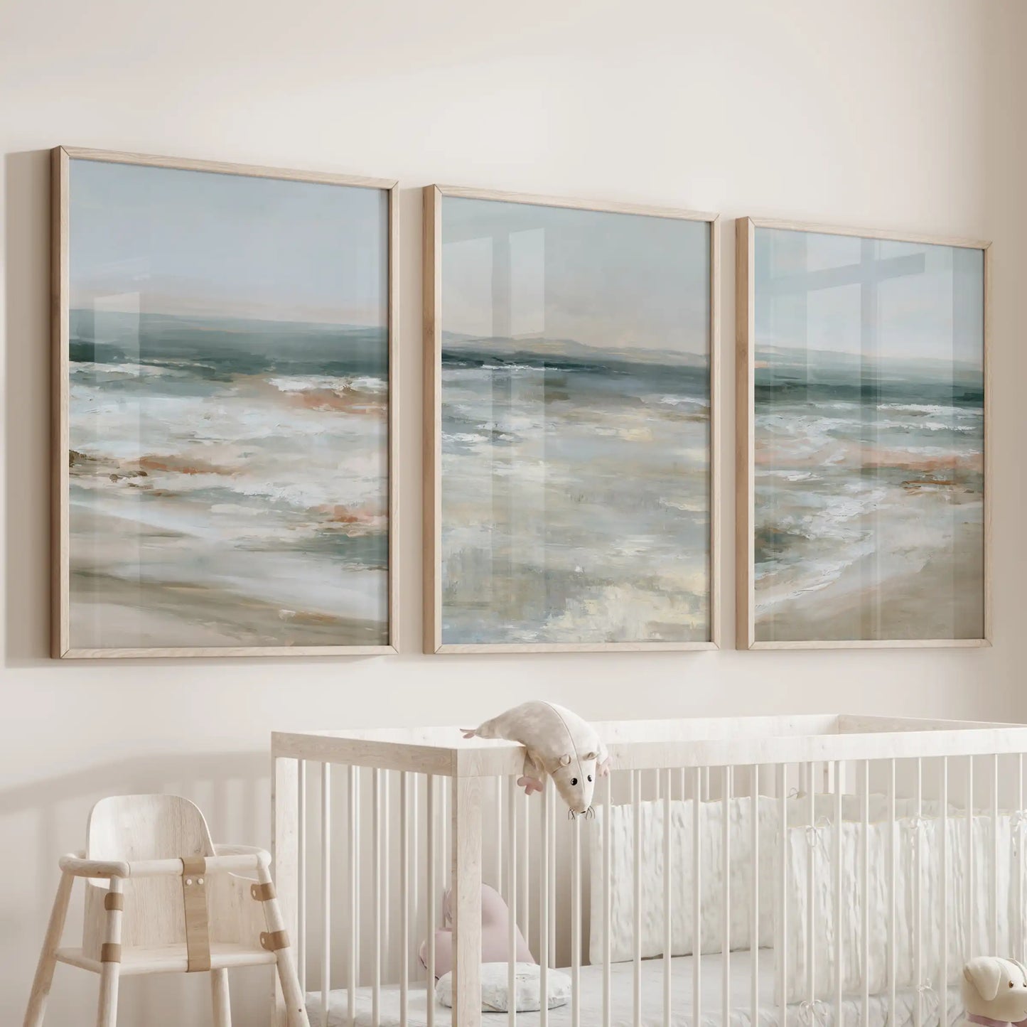 Light-wood frames cradle this trio of ocean prints, floating over the bassinet and filling the infant room with airy peacefulness.