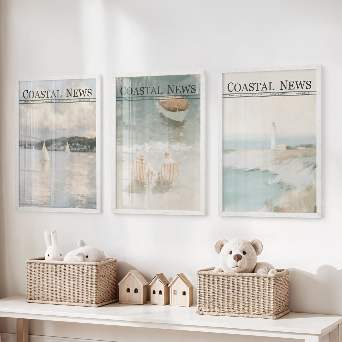 Three-piece wall poster set in white frames, depicting sailboat, beach, and lighthouse scenes above a playroom toy organizer.