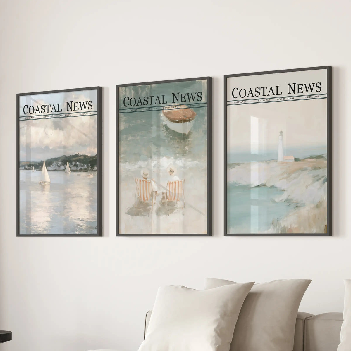 Set of three seaside wall prints in black frames, displayed behind a couch in a neutral living room.