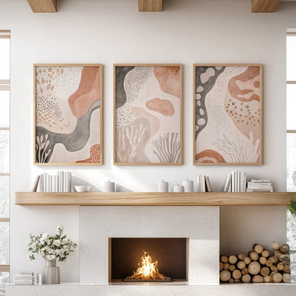 Terracotta geometric patterns, a three-piece wall art set in natural wood frames, sit above the mantel to warm the living room.
