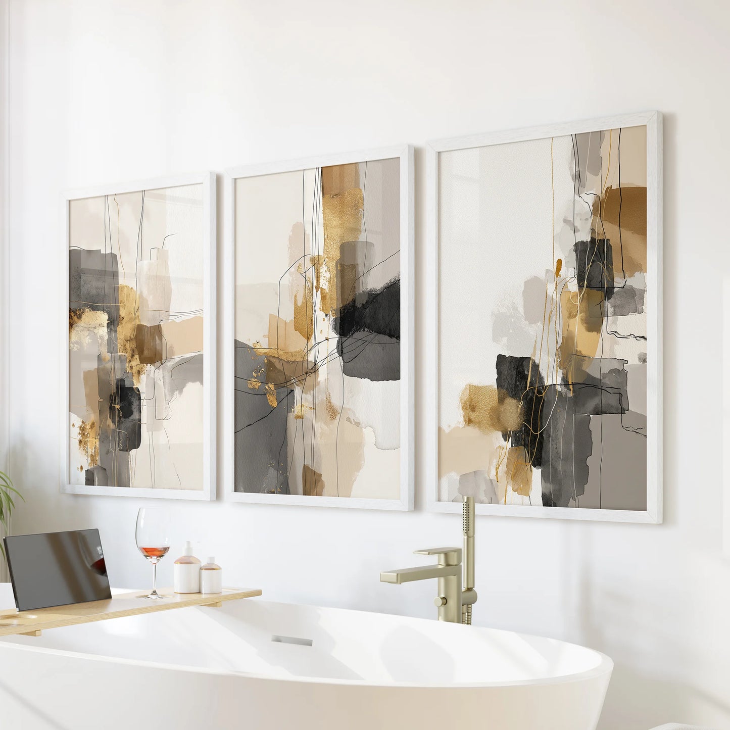 Black and gold brushstrokes, a three-print framed wall art set in bright white frames, bring quiet drama above the bathtub while keeping the bathroom serene.