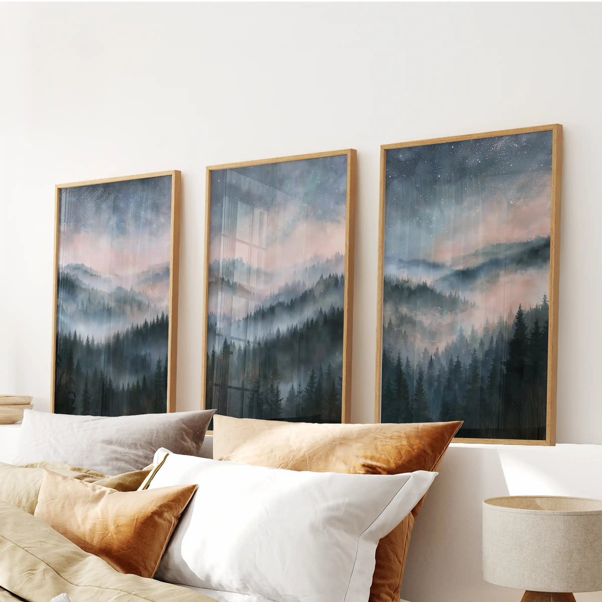 Pine woodland in fog poster art, a trio set for the bedroom, floated over the headboard in warm wood frames.
