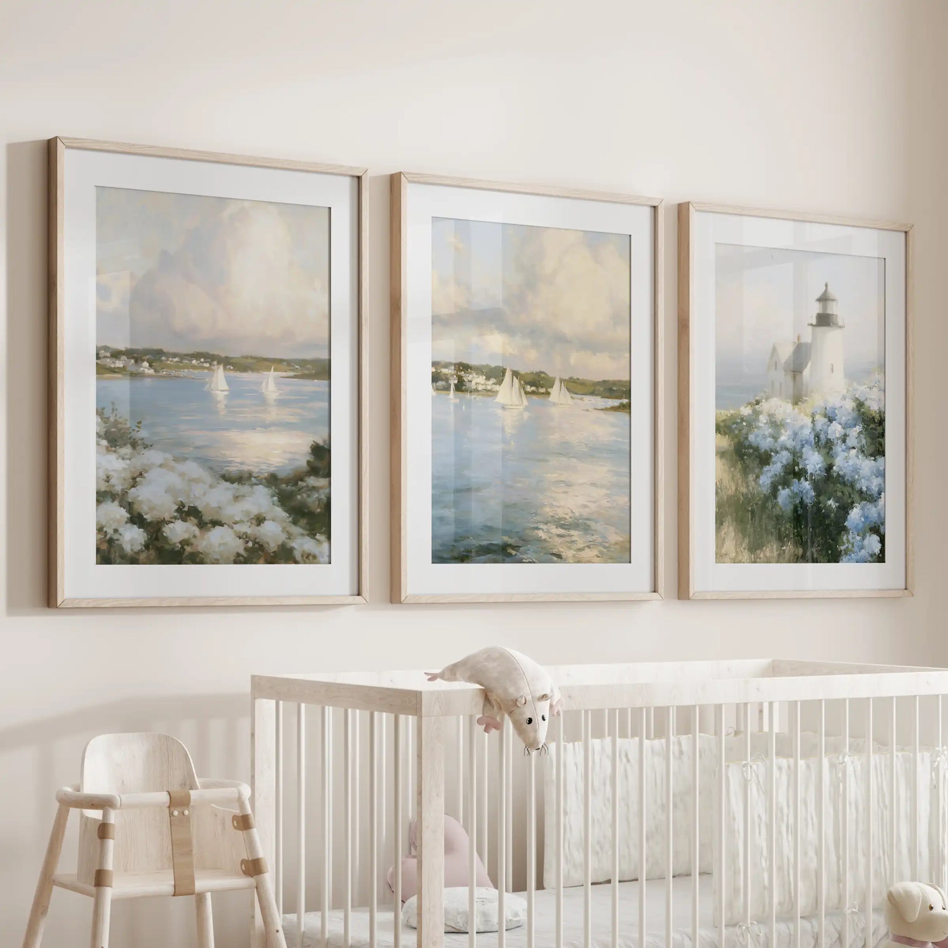 Cape Cod lighthouse artwork set of three, wood-framed with mats, offers a gentle nautical focal point in the nursery over the cot.