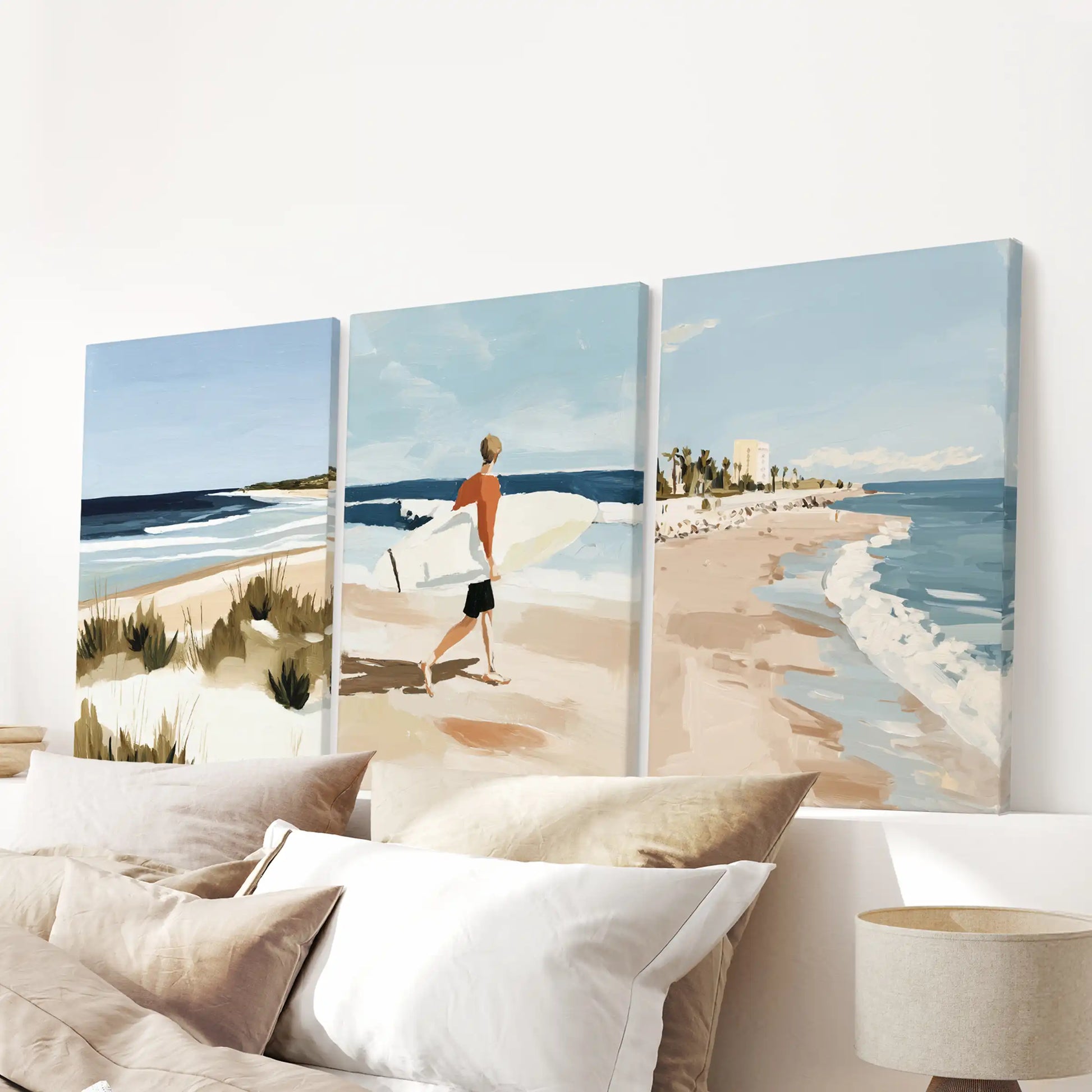 Gallery-wrapped surf canvases, a coordinated set of three, line the wall above the headboard to bring texture, depth, and calm.