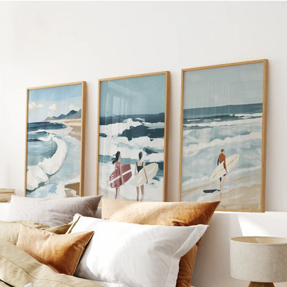 Surfer wall art three-piece set in oak wood frames, mounted above the headboard to lend easy motion to the bedroom.