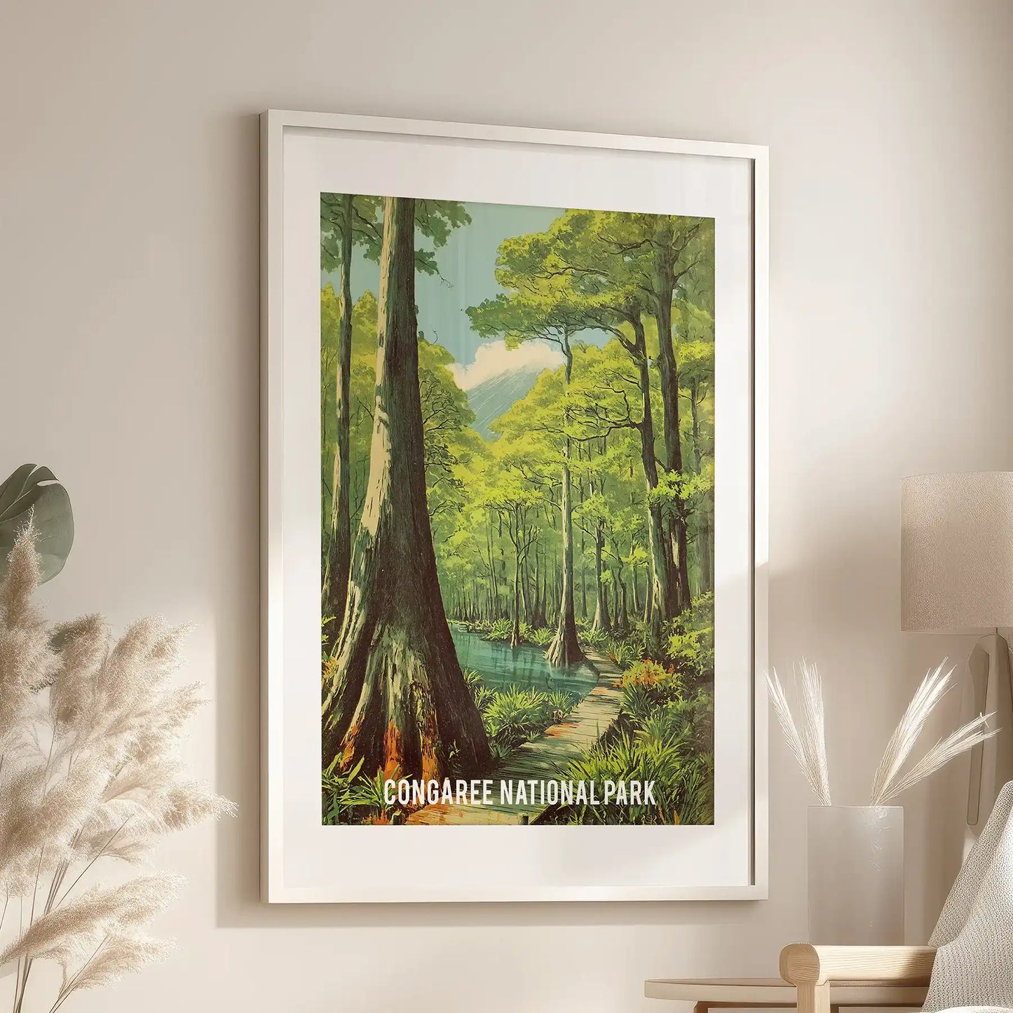 Old-growth woodland canopy art print, wide-matted in a white frame, hangs above the family-room sofa, offering a peaceful glimpse of South Carolina nature.