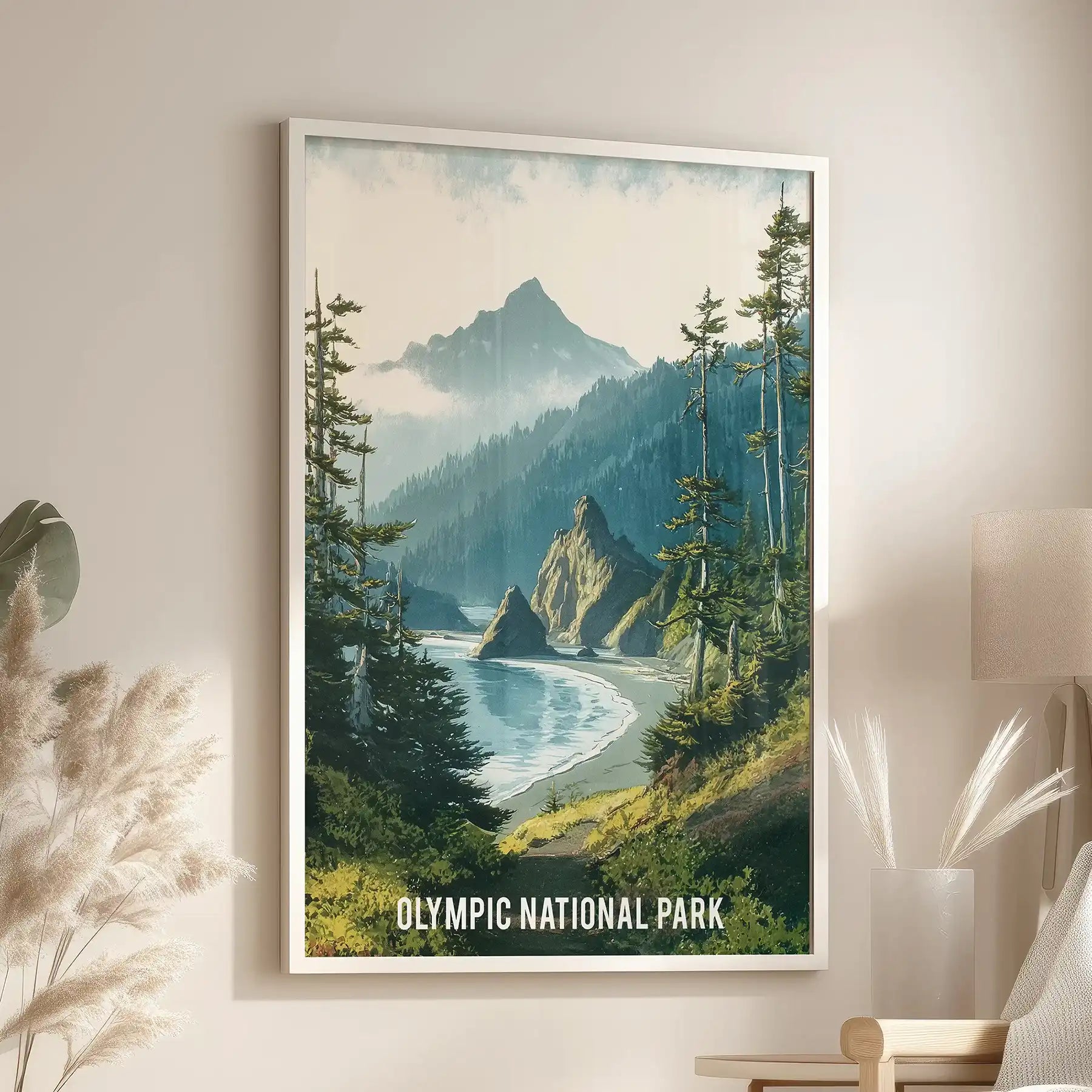 A white-framed wall print of evergreen wilderness softens a sitting room above a cozy chair with gentle depth and lush canopy hues.