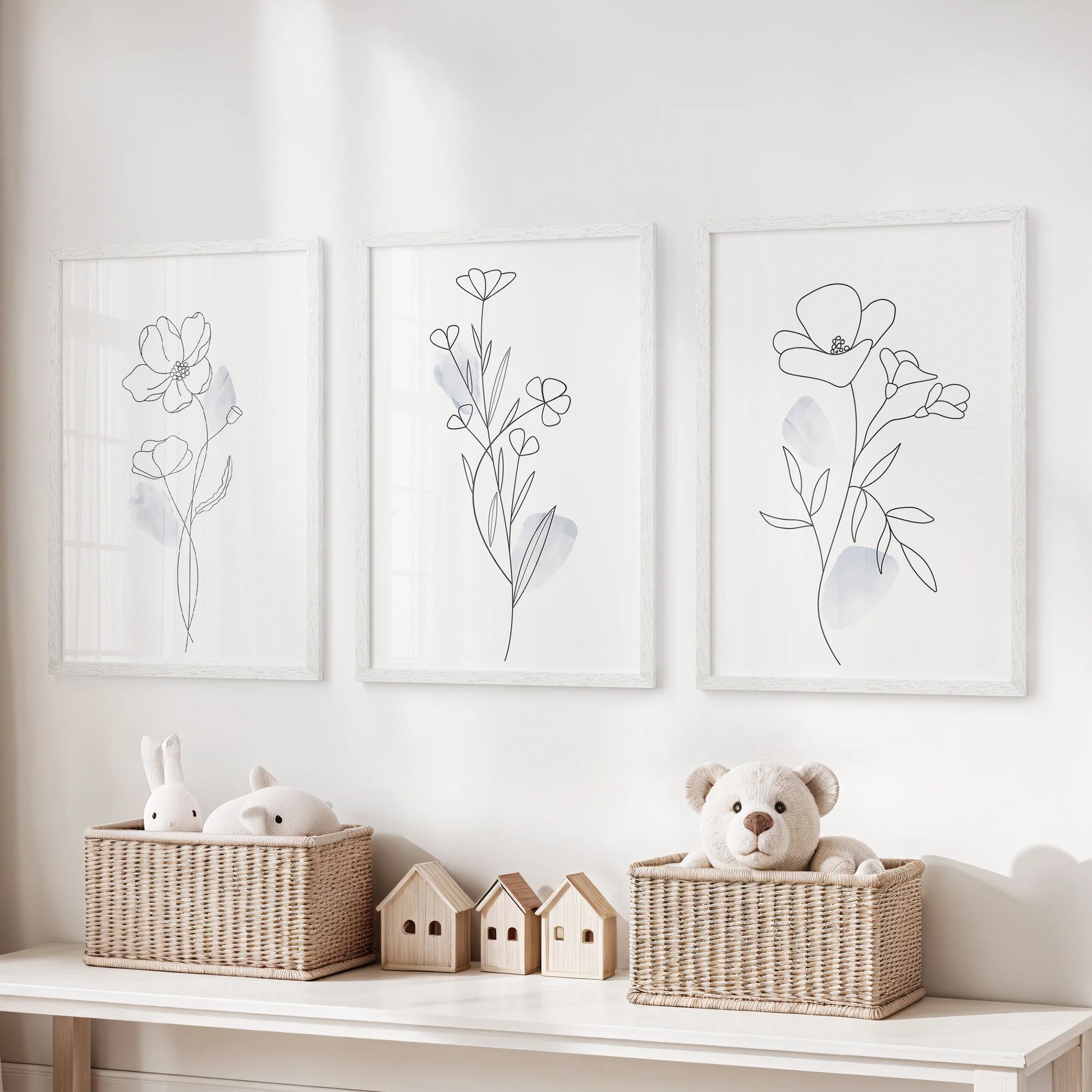 Minimalist botanical line art, set of 3 wall decor in white frames, brightens the kids playroom with gentle shapes and airy negative space.