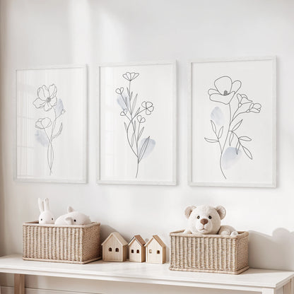 Minimalist botanical line art, set of 3 wall decor in white frames, brightens the kids playroom with gentle shapes and airy negative space.