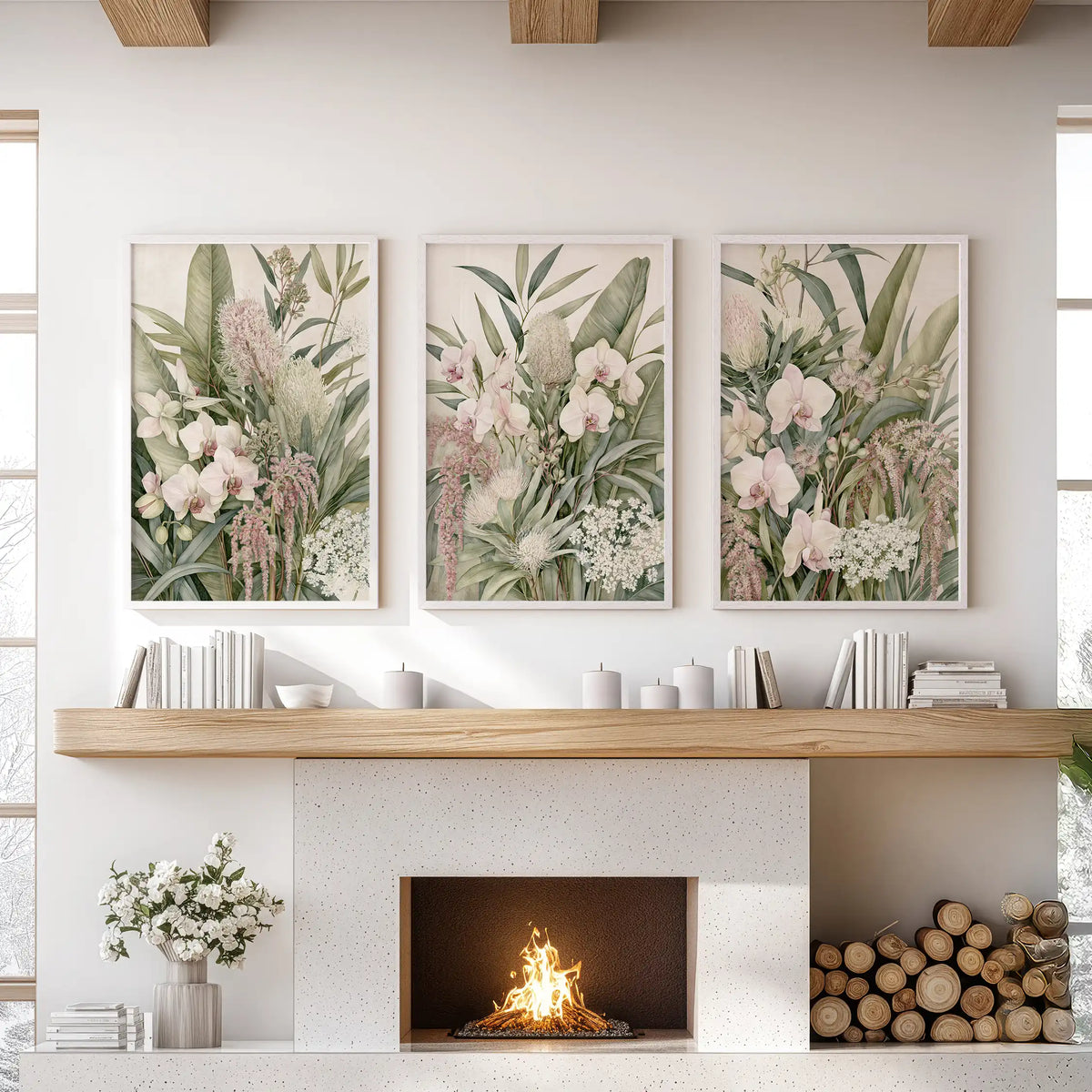 Tropical botanical prints in white frames, a set of three above a fireplace.
