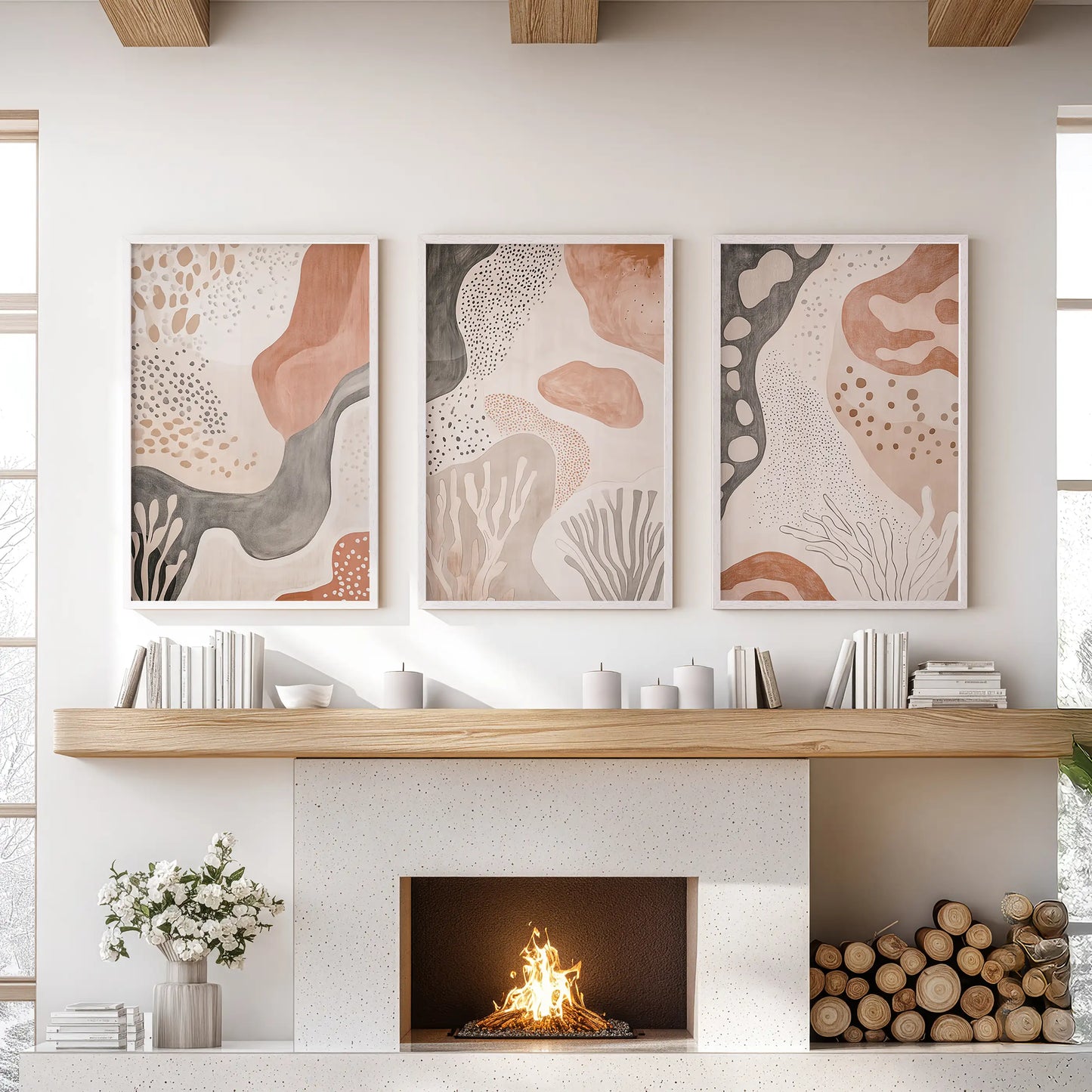 Mid-century modern organic forms, a set of three wall prints in white frames, crown the living room mantelpiece with effortless balance.
