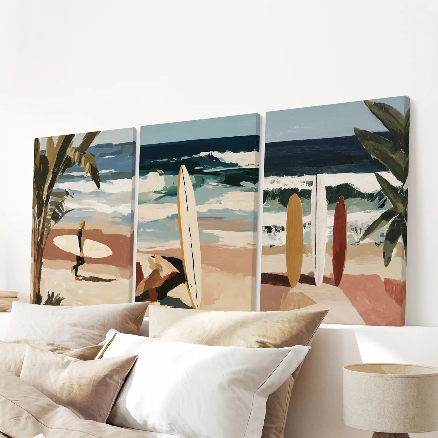 A gallery-wrapped trio of surfboard posters crowns the bedroom above the headboard, adding crisp shapes and balanced beach color.