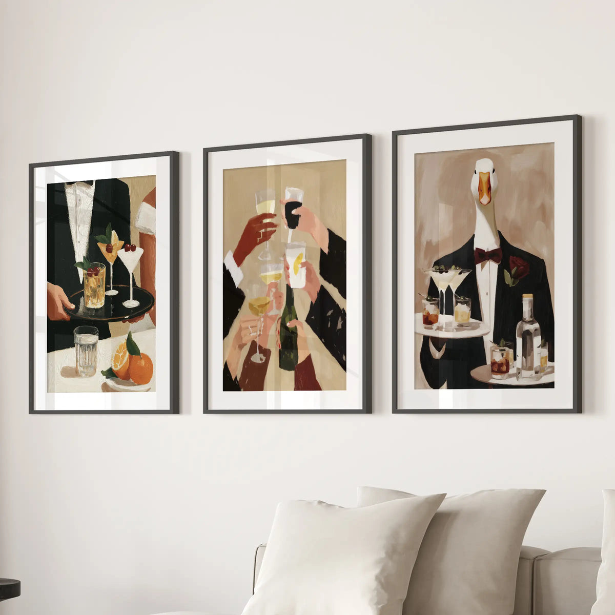 Painterly bartender wall art in a set of three prints, shown in matted black frames above a sitting room couch.