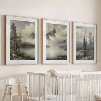 Three-piece wall hanging featuring painterly nature landscapes in solid oak frames with mats, displayed over a nursery crib.