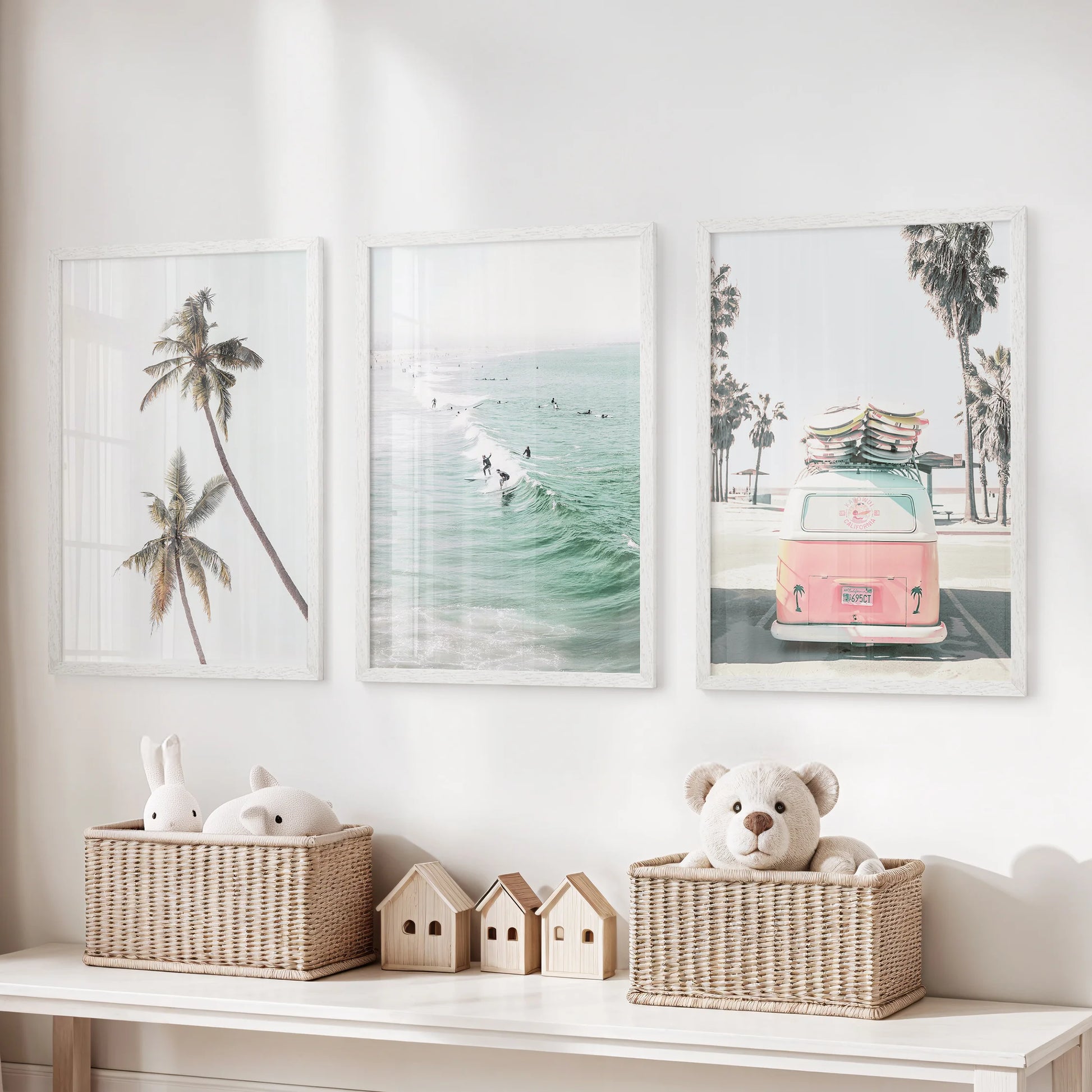 This three-piece surfer wall art set, framed in bright white, brings a lively coastal feel and sense of motion to the playroom.