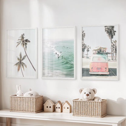 This three-piece surfer wall art set, framed in bright white, brings a lively coastal feel and sense of motion to the playroom.