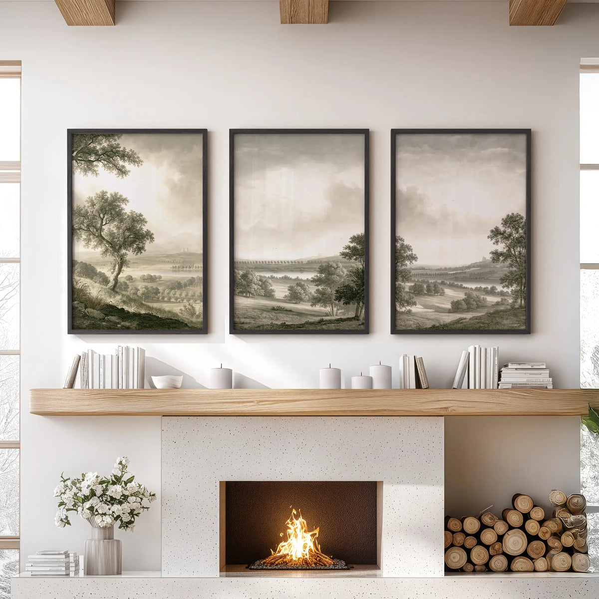 Pastoral countryside wall art in a set of three, displayed in black frames above the hearth in a lounge with a sofa and coffee table.