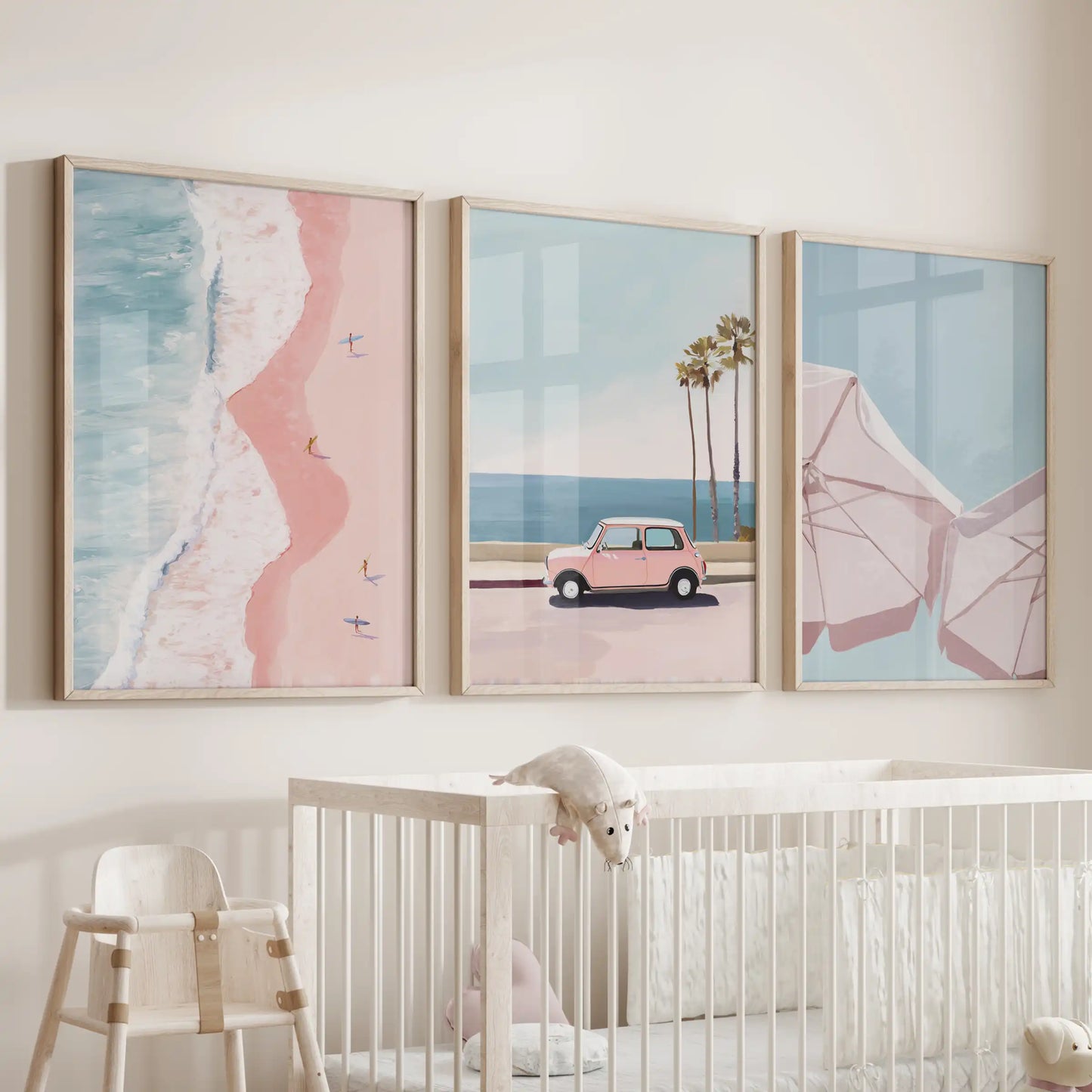 Minimalist beach landscapes, three wood-framed wall art pictures, lend a peaceful coastal note above the cot in the baby room.