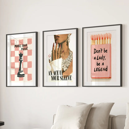 Fashion portrait wall art set of three in black matted frames, arranged over the sofa in a living room.