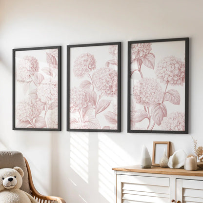 Blush hydrangea prints in black frames, a set of three above a dresser in a kids' room.