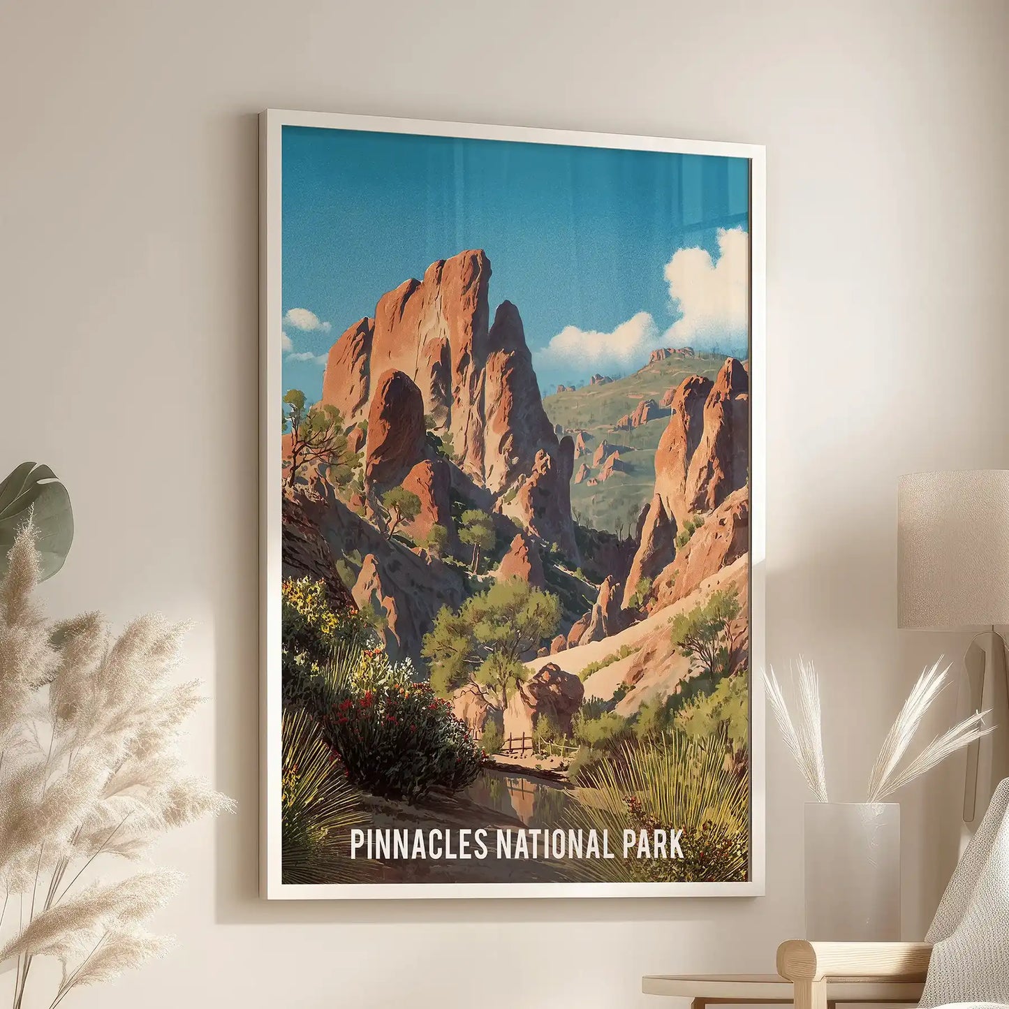 White-framed wall art of a desert canyon scene centers a living room nook, mounted above a chair by the window for a calm Southwest touch.