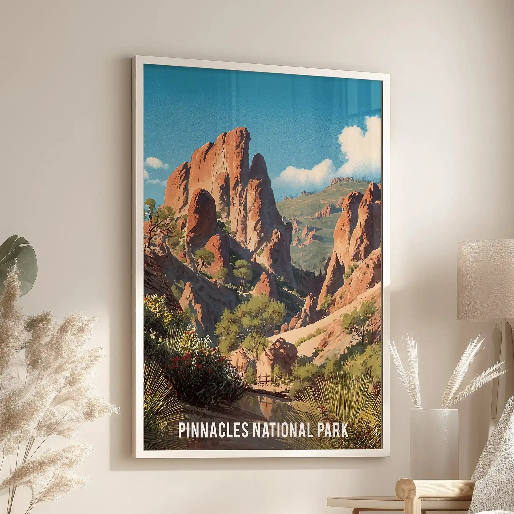 White-framed wall art of a desert canyon scene centers a living room nook, mounted above a chair by the window for a calm Southwest touch.