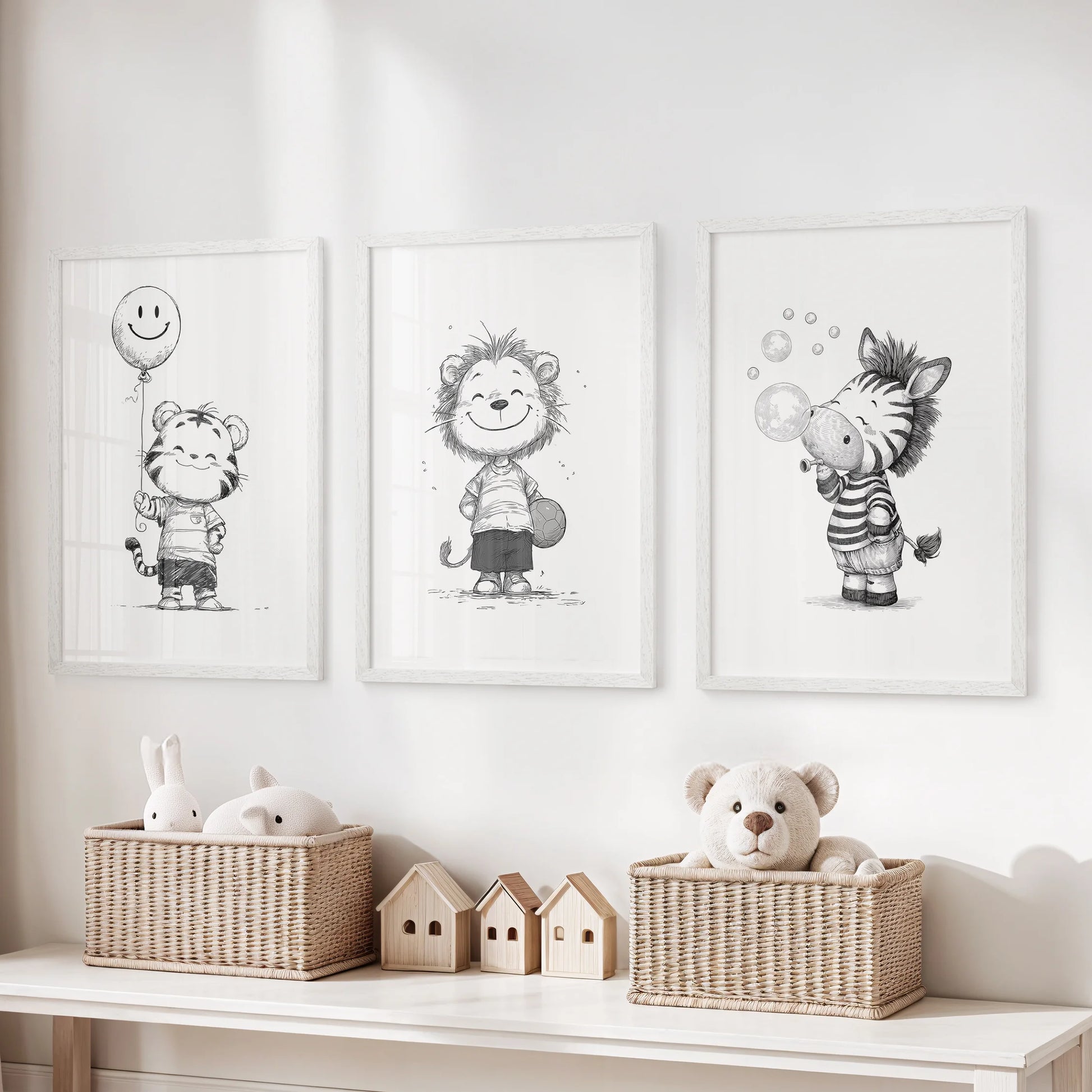 A 3-print wall art set of black-and-white safari animals in white frames adds cheerful personality to the playroom’s wall decor.