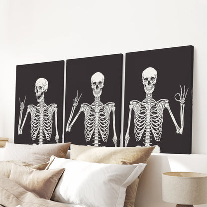 Wrapped canvas prints of a skeleton trio complete the bedroom wall above the bed, finishing the space with a witty Halloween accent.