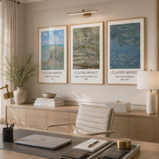 Three Claude Monet landscape and water lily prints in natural wood frames decorate a warm home office as the camera moves closer