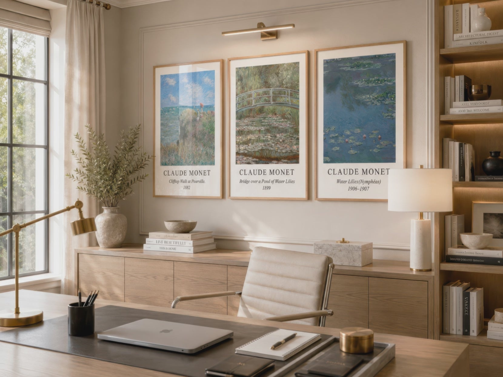 Three Claude Monet landscape and water lily prints in natural wood frames decorate a warm home office as the camera moves closer