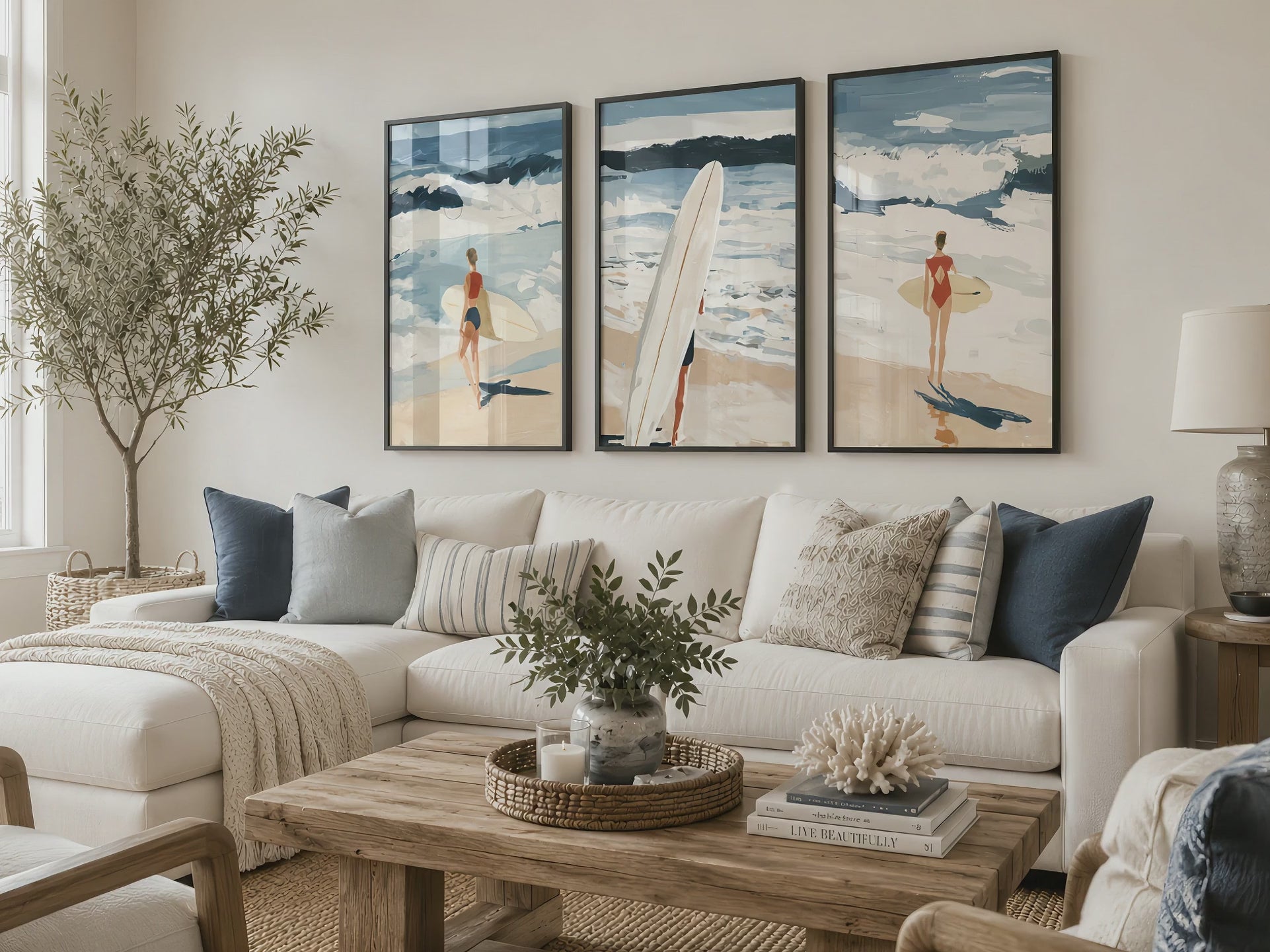 Set of three coastal surfing prints in black frames draw the eye above a white sectional sofa during a smooth cinematic push-in