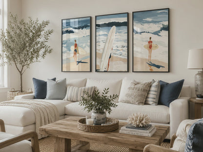 Set of three coastal surfing prints in black frames draw the eye above a white sectional sofa during a smooth cinematic push-in