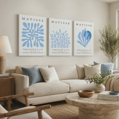 Three blue Matisse botanical wrapped canvas prints bring a soft coastal accent to a neutral living room as the camera slowly moves closer