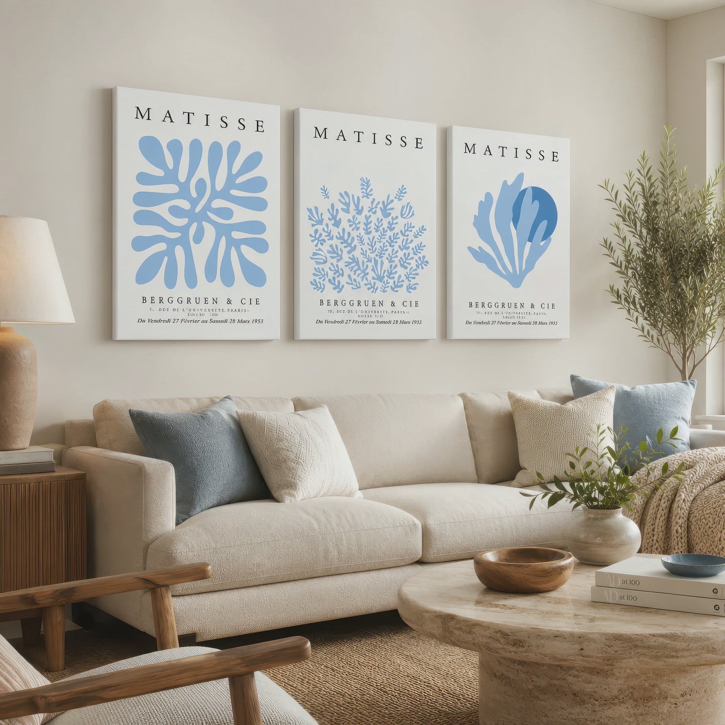 Three blue Matisse botanical wrapped canvas prints bring a soft coastal accent to a neutral living room as the camera slowly moves closer