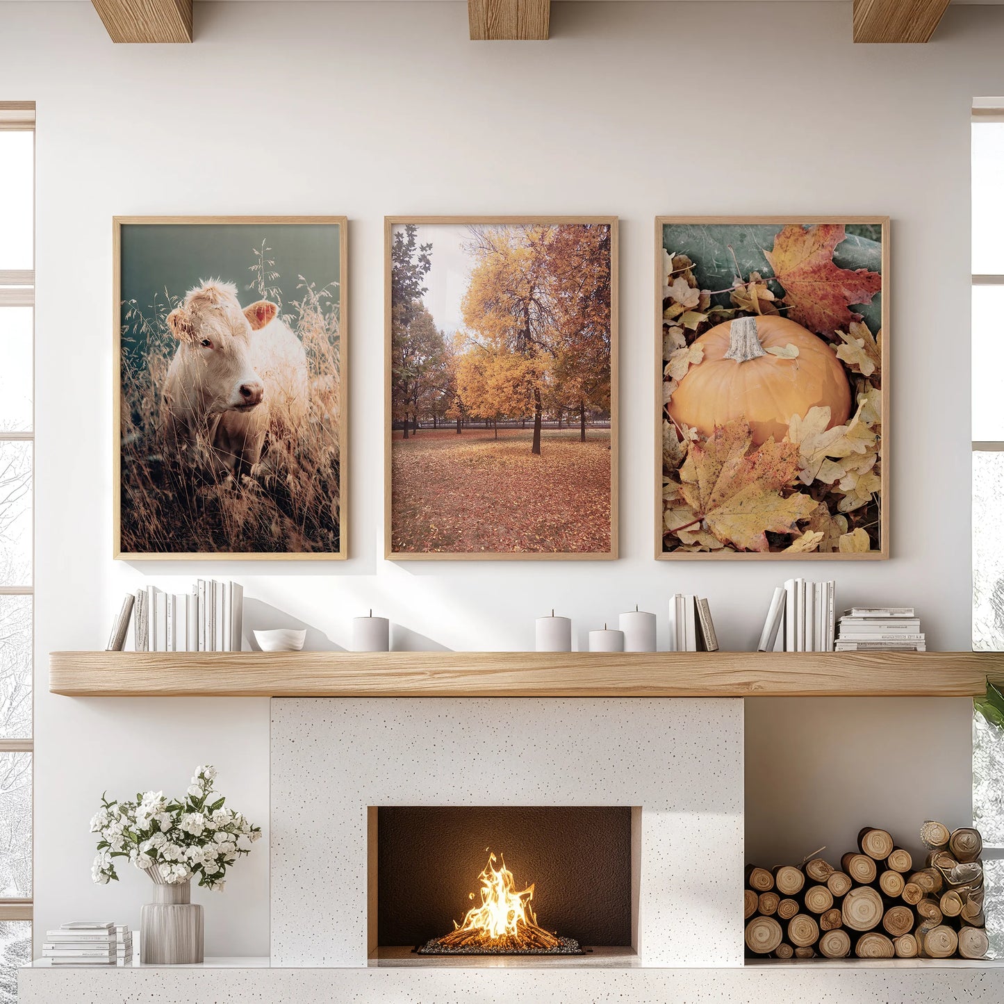 Three natural-wood framed prints of pumpkin harvest scenes hang over the family-room mantelpiece for a rustic autumn look.