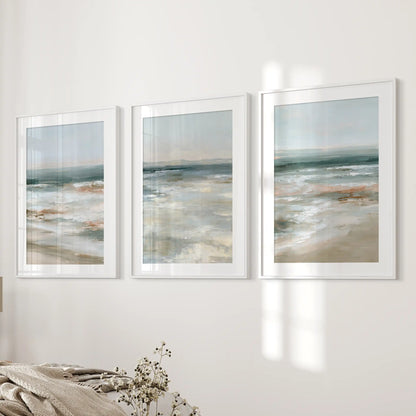 Soft blue seascape set of 3 prints in white mat frames lends gentle wall art near the bed wall, easing the bedroom into a restful coastal vibe.