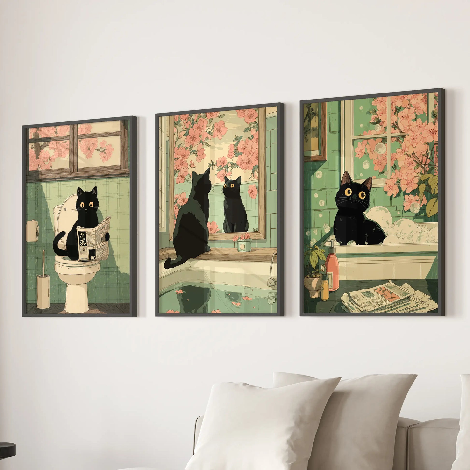 Vintage Japanese cat bathroom poster triptych, set of three, in black framed prints hung over the sectional in the lounge.