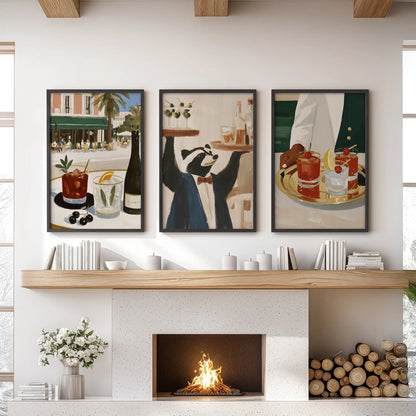 Three-print wall art set featuring cocktail drinks, displayed in black frames over a living room fireplace mantel.