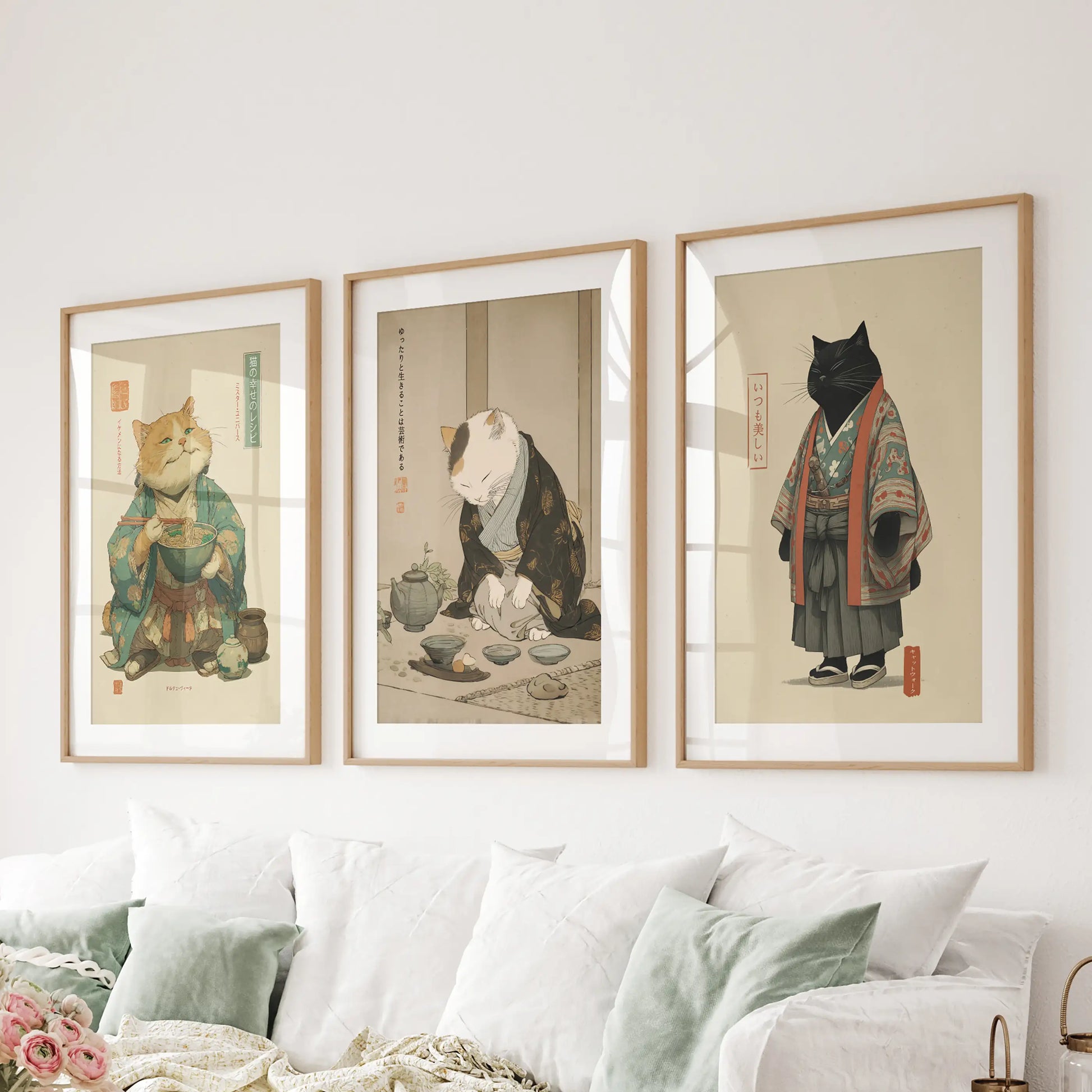 Ramen bowl with chopsticks and cat, a three-piece wall decor set in light wood frames with mats, centers the family room over the couch with a nod to Japanese dining.