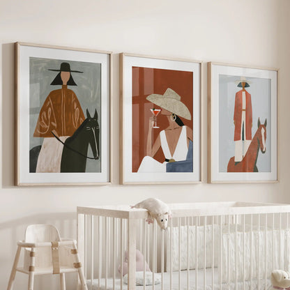 Cowgirl portraits, three-piece wall decor in wood frames with mats, hangs sweetly in the baby room over the crib.