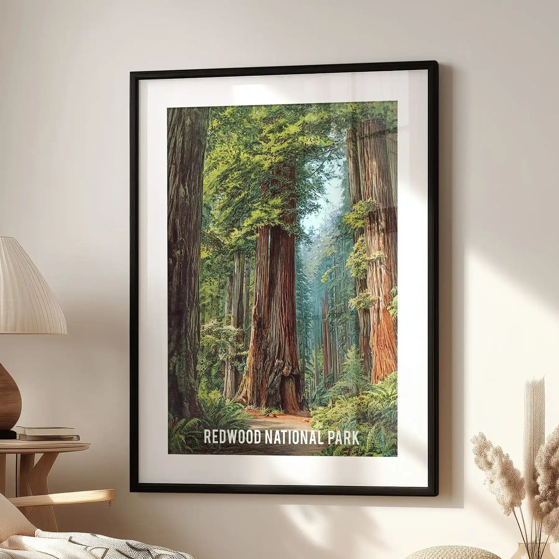 Single wall art of giant sequoias, wide-matted in a black frame, gives a clean gallery feel above a living-room window chair.
