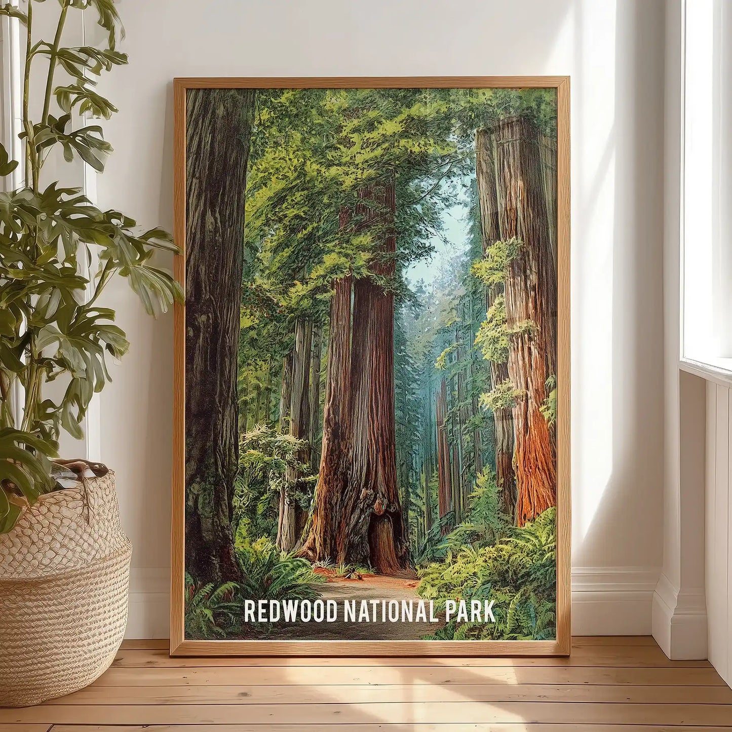 Vintage national park poster print for wall sits in a wood frame, resting on a bedroom floor for relaxed styling before finding its spot.