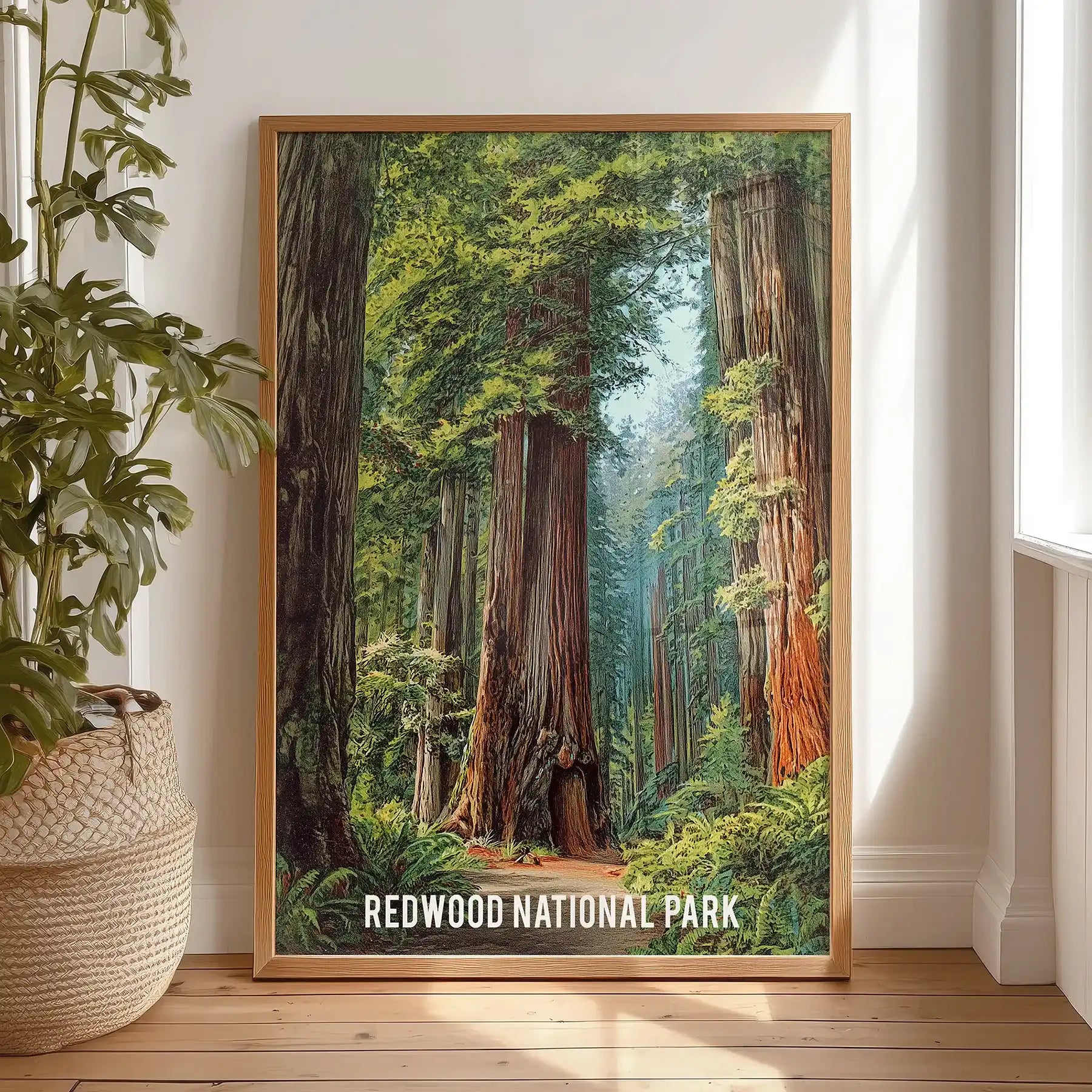 Vintage national park poster print for wall sits in a wood frame, resting on a bedroom floor for relaxed styling before finding its spot.