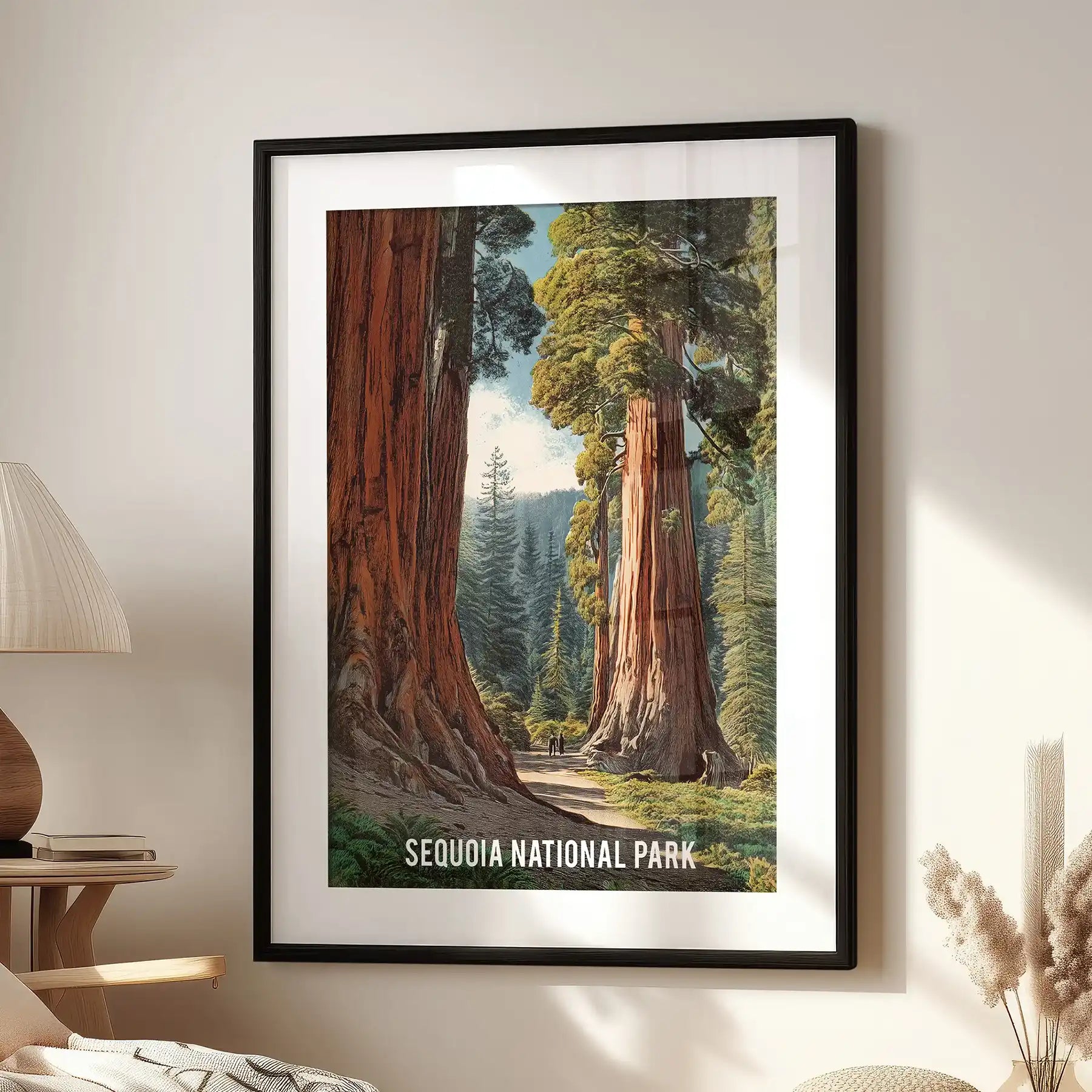 Sequoia National Park trail wall artwork in a black frame with mat sits beside a reading chair in the lounge, a crisp travel print that anchors the space.