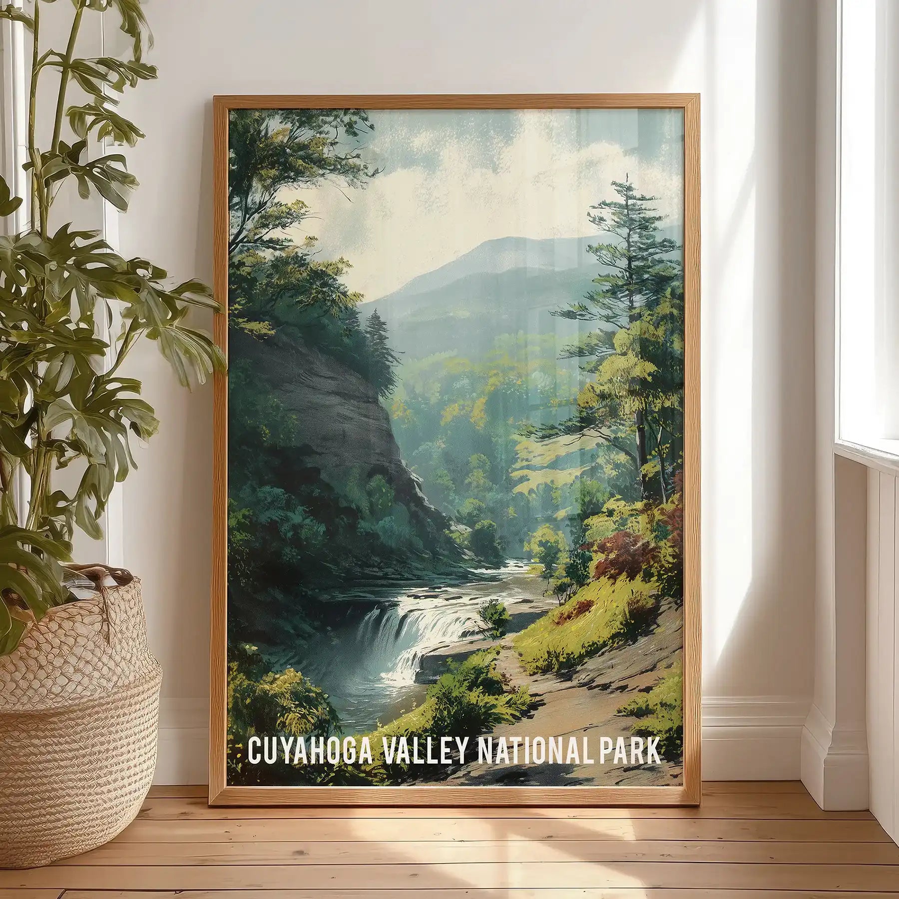 Cuyahoga Valley National Park art print, a single natural wood-framed piece, rests against the bedroom wall and brings warm, earthy greens to a quiet nook.