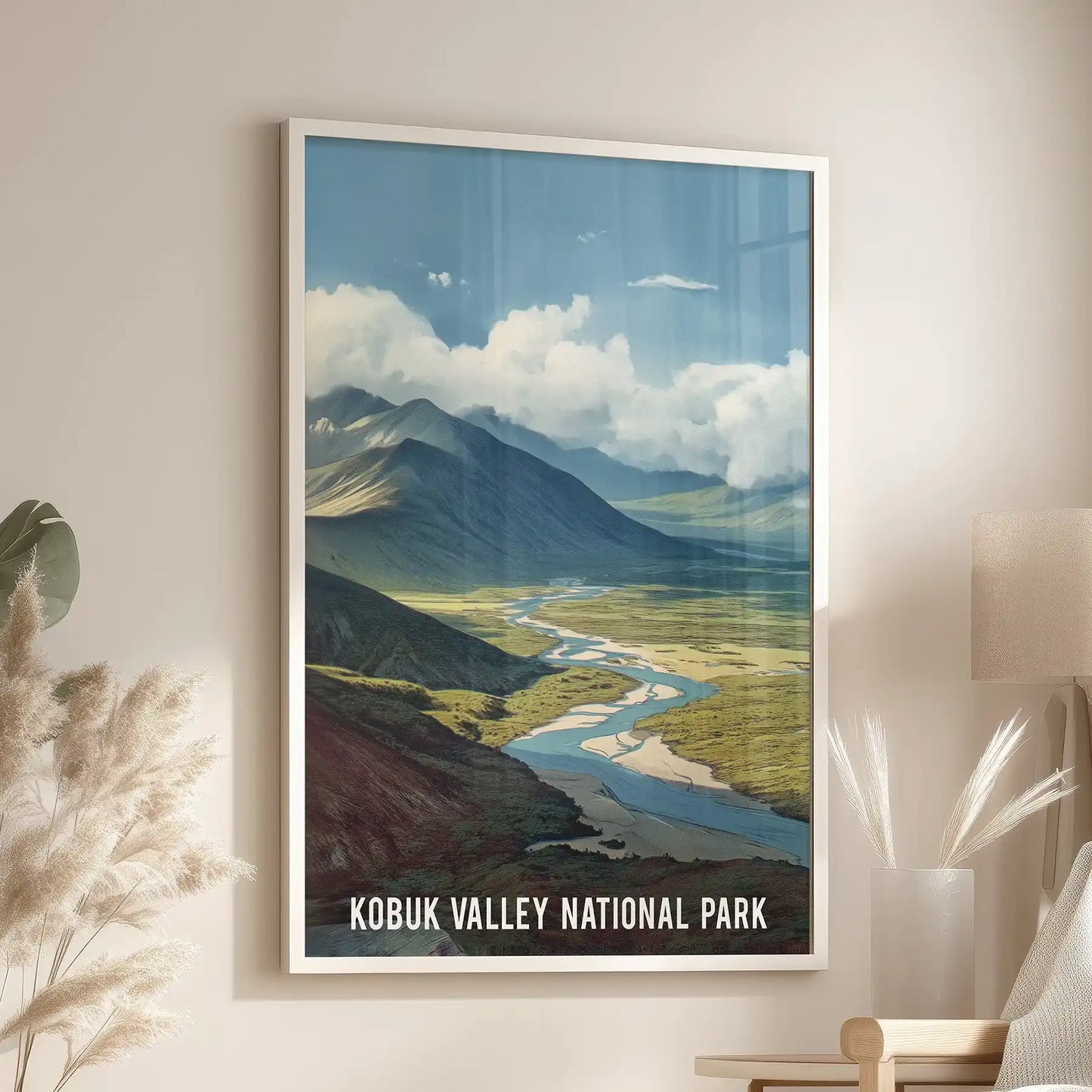 Mountain valley scenery single poster print in a white frame rests over the accent chair in the family room, a bright, retro nod to Alaska’s open spaces.
