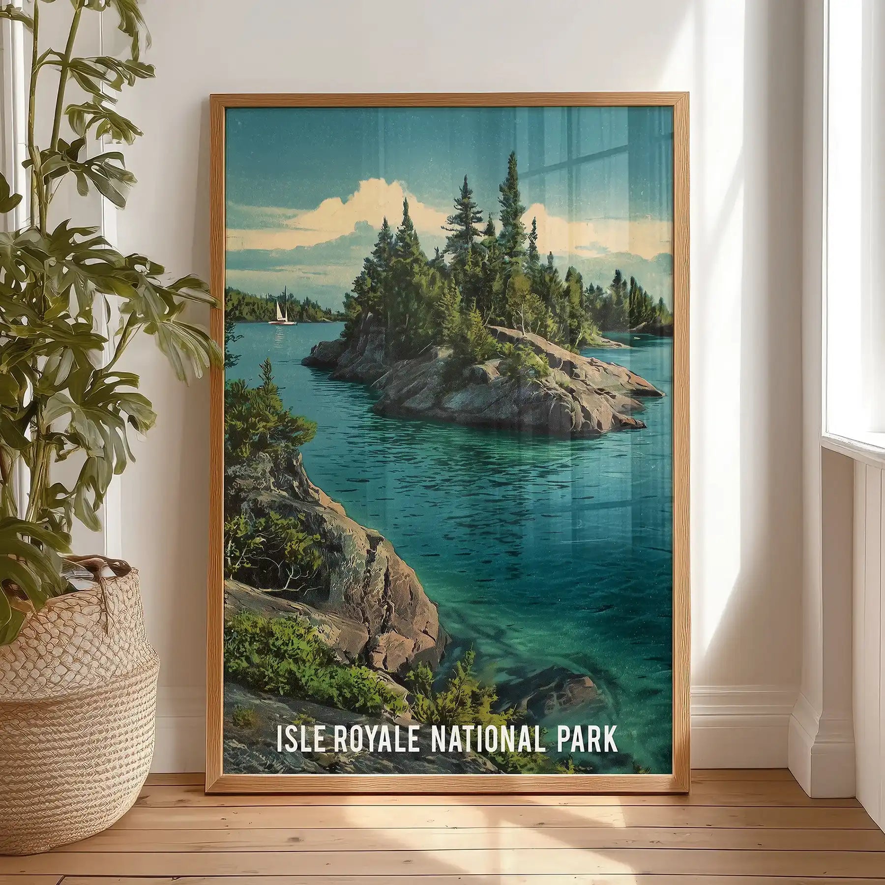 Deep teal forest lake poster print in a thin wood frame, leaning on the bedroom floor against the wall to lend relaxed, cabin-like charm.