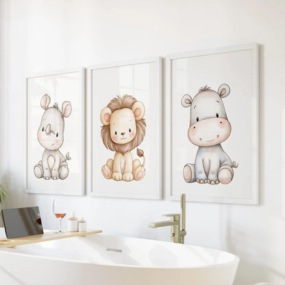Three rhino, lion and hippo prints in white frames above a freestanding bathtub.