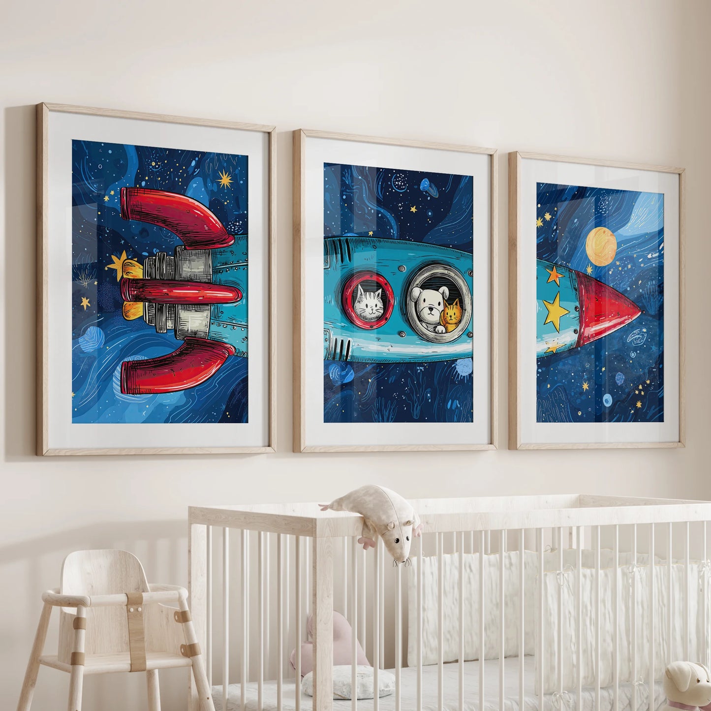 Three cartoon rocket wall pieces in wooden frames with mats cheer the nursery wall above the crib, tidy and kid-friendly.